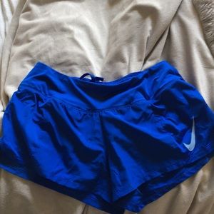 Blue nike running shorts